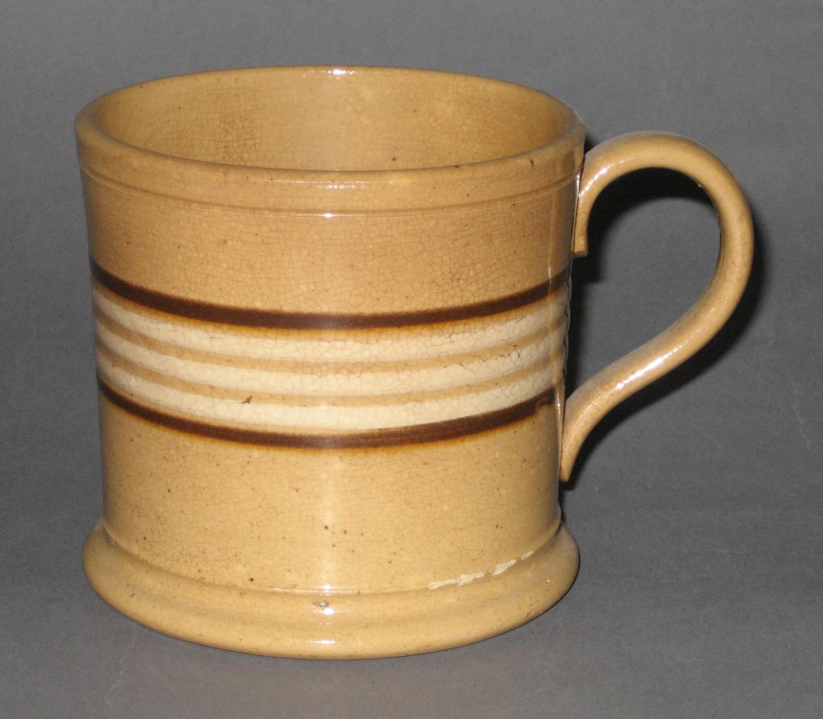 2008.0053.021 Yellow (dipped) ware mug