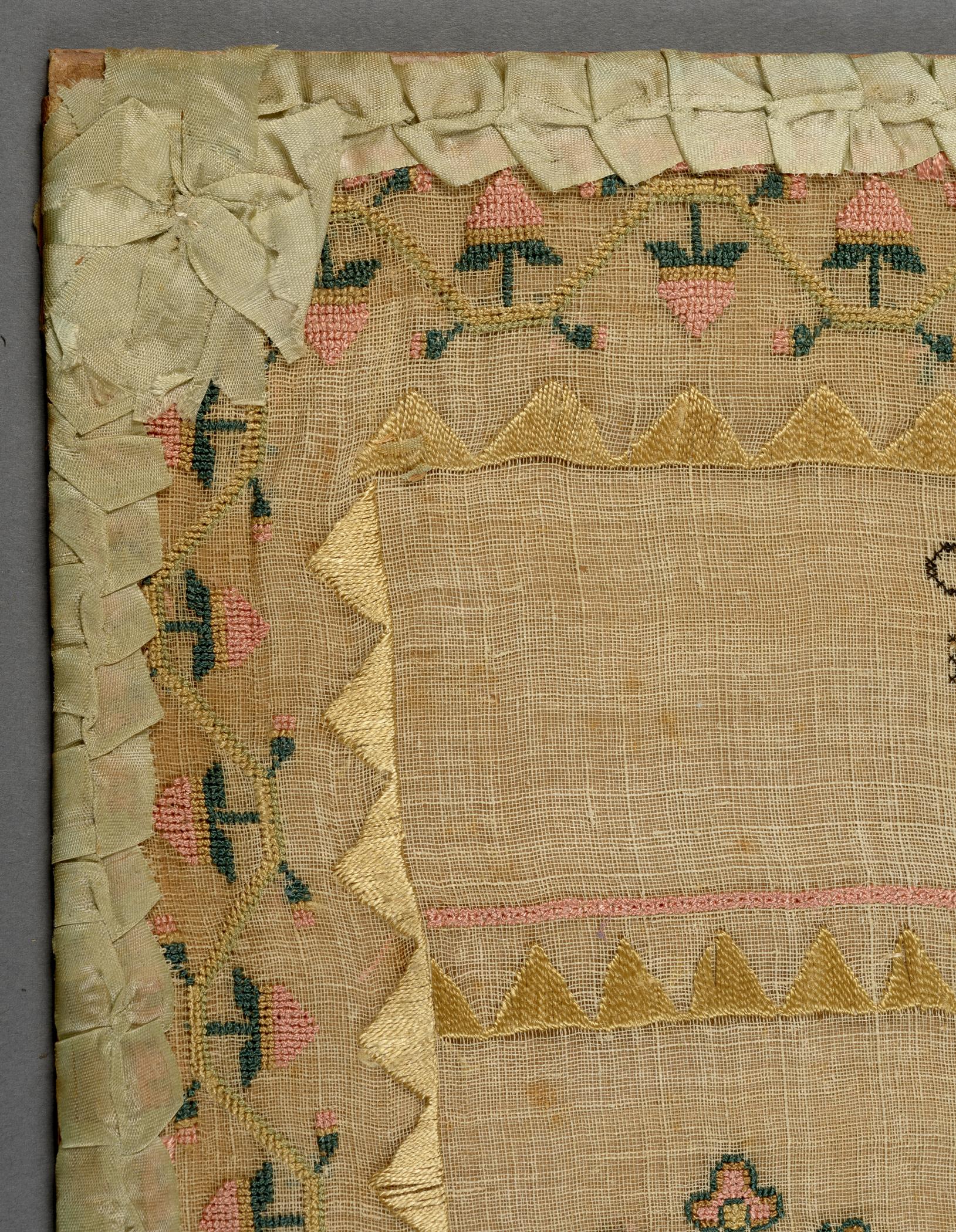 2009.0006 A Sampler, detail 1, before conservation treatment