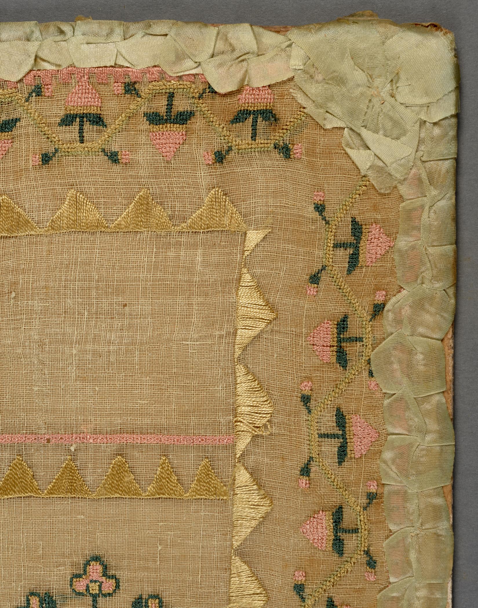 2009.0006 A Sampler, detail 2, before conservation treatment