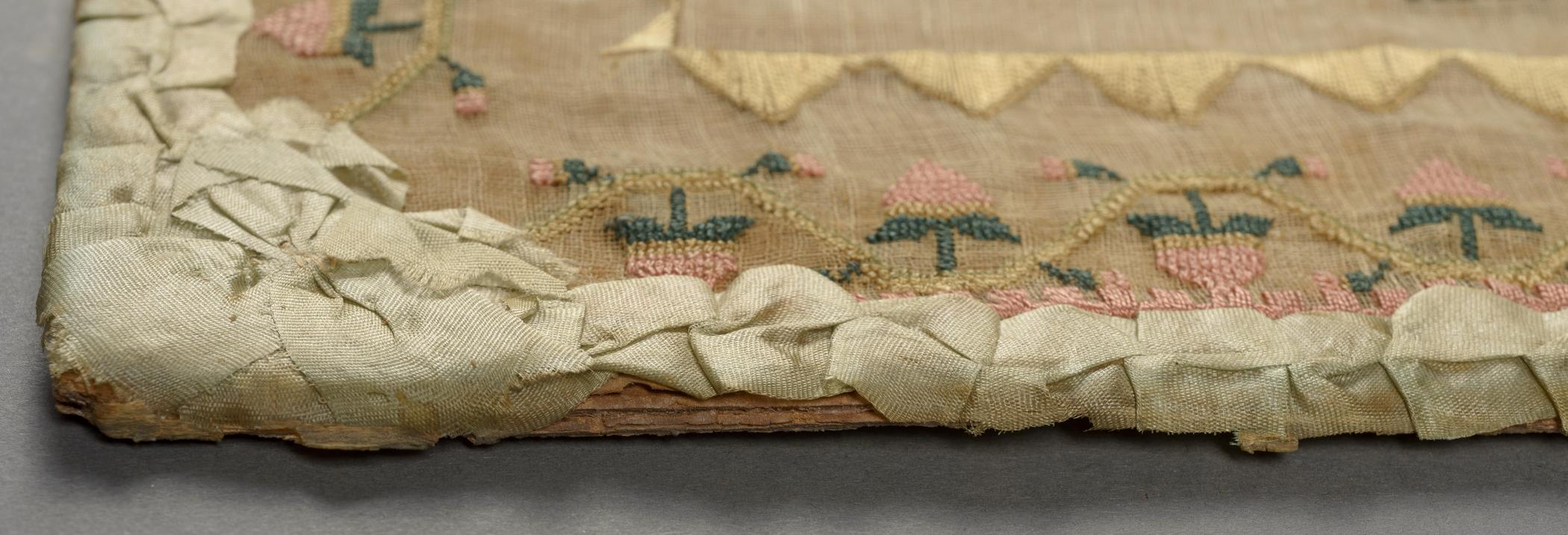 2009.0006 A Sampler, detail 3, before conservation treatment