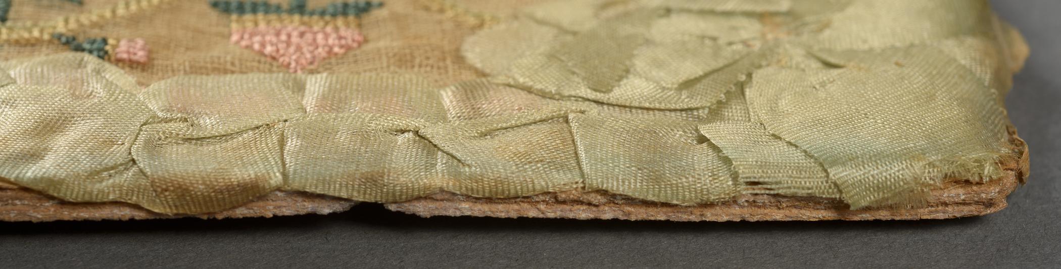 2009.0006 A Sampler, detail 4, before conservation treatment