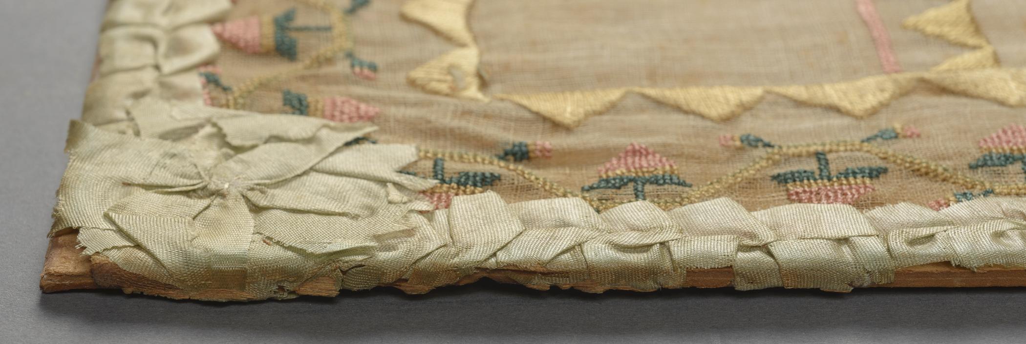 2009.0006 A Sampler, detail 5, before conservation treatment