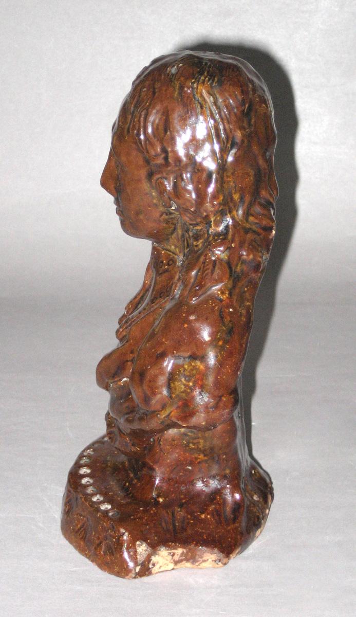 2009.0027 Redware bust of Milton side