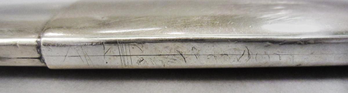 1958.2515 A, B Spectacles case, inscription