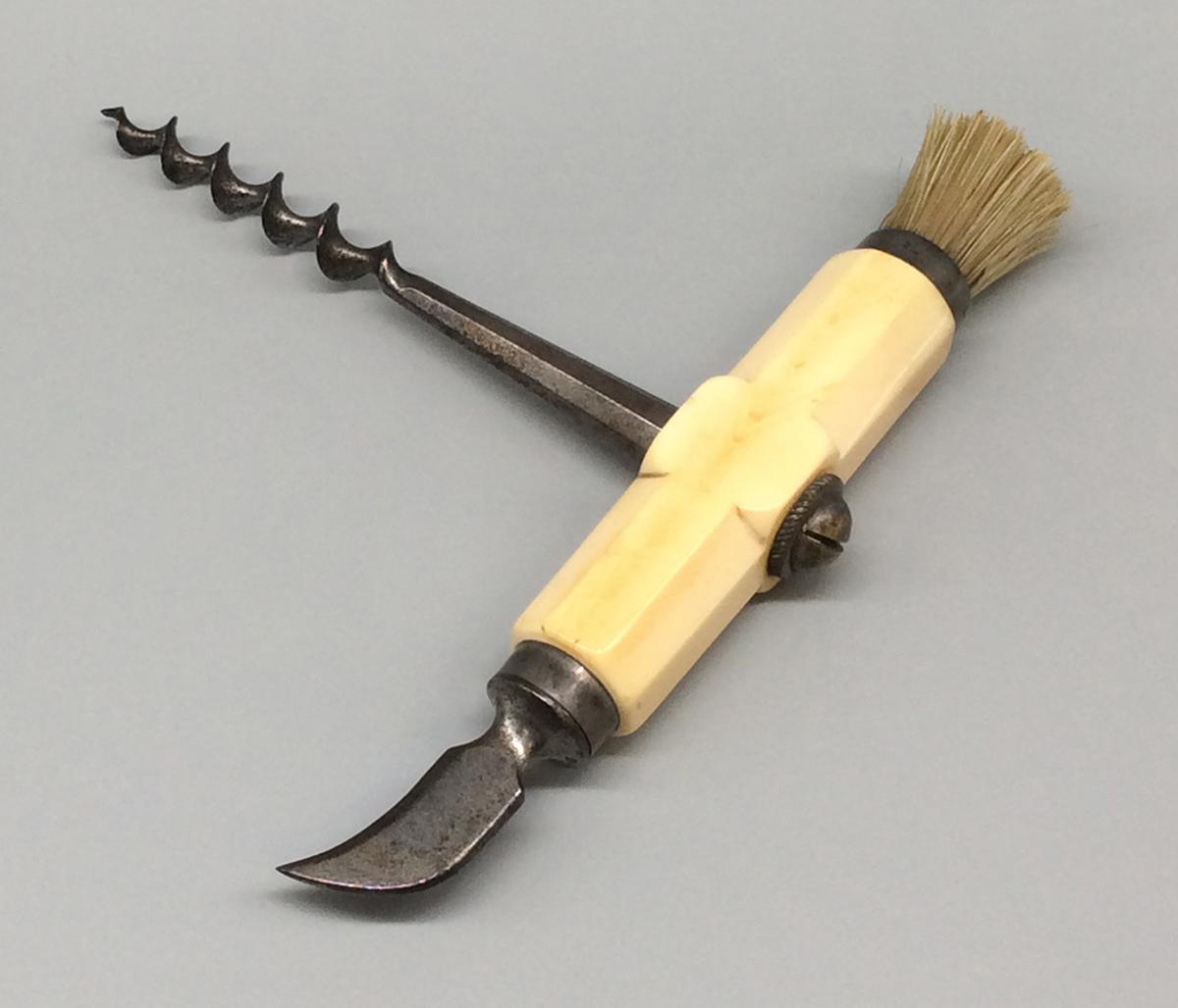 1958.2538 Corkscrew with brush, view 1