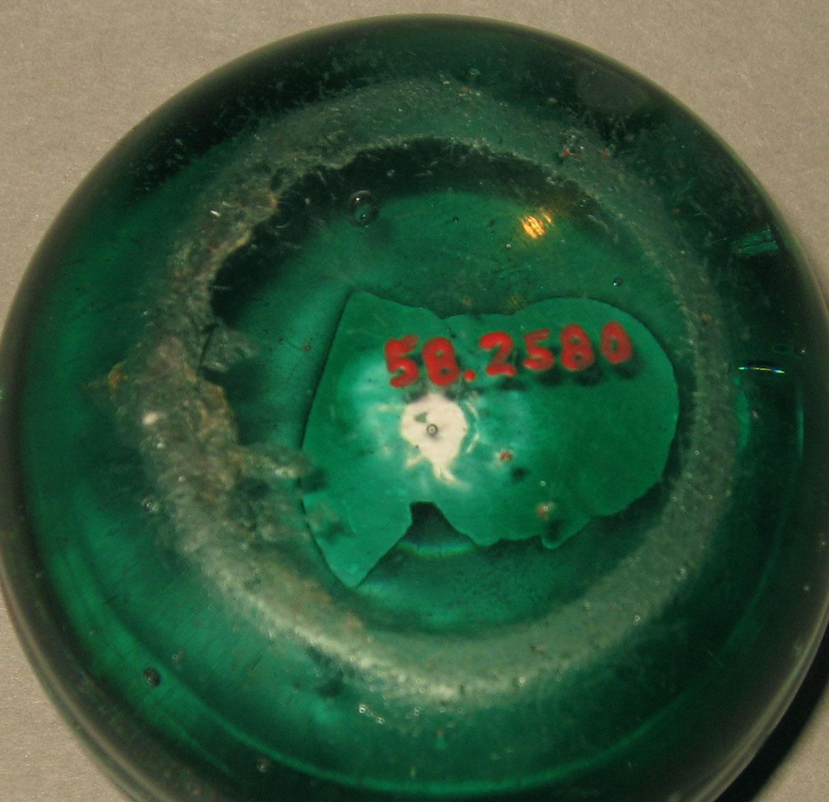 1958.2580 Glass paperweight (underside)